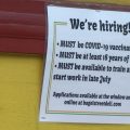 Bagel Street Deli sign with the covid-19 vaccination requirement for employment