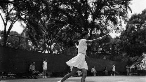 Althea Gibson serving tennis ball