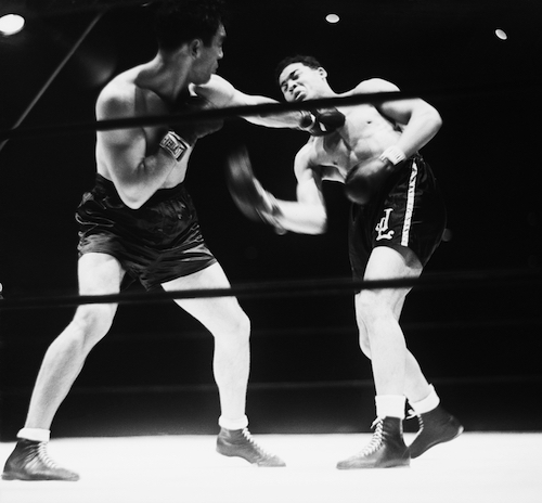 Max Schmeling lands a left to the face of Joe Louis in 1936