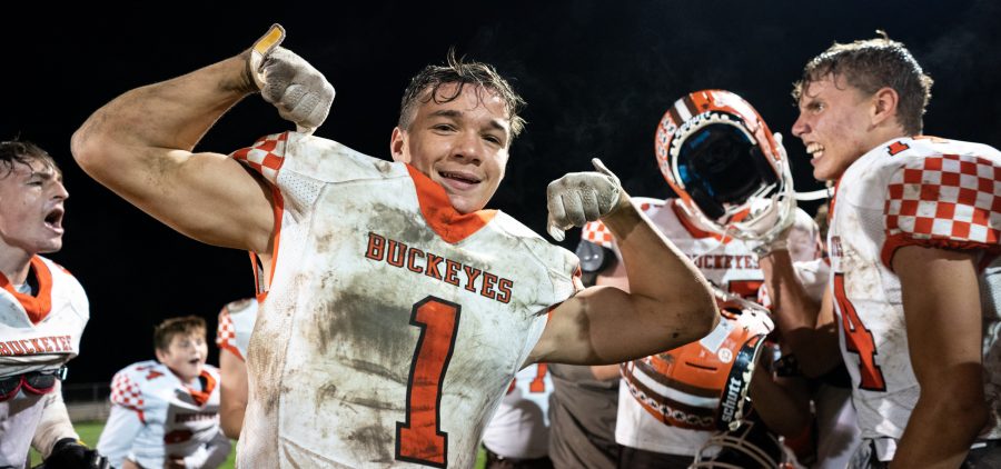 Gavin Richards of the Nelsonville York Buckeyes strikes a pose in the midst of his team celebration after their 13-6 win over the Meigs Marauders in Pomeroy, Ohio, on Friday, Sept. 24, 2021. [Joseph Scheller | WOUB]