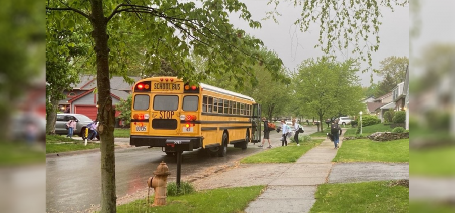 A school bus in suburban Columbus picks up students in September 2020.