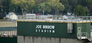 Joe Burrow Stadium is seen with fall foliage in the background.