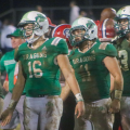 Fairland players with muddy jerseys lined up post-game