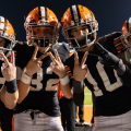 Ironton players display the "peace" sign posing for a photo