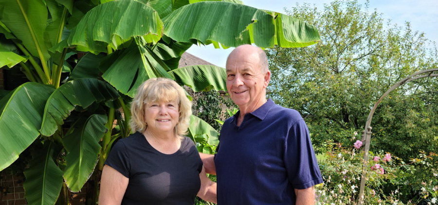 Neal and Barbara Caldwell in front of their garden