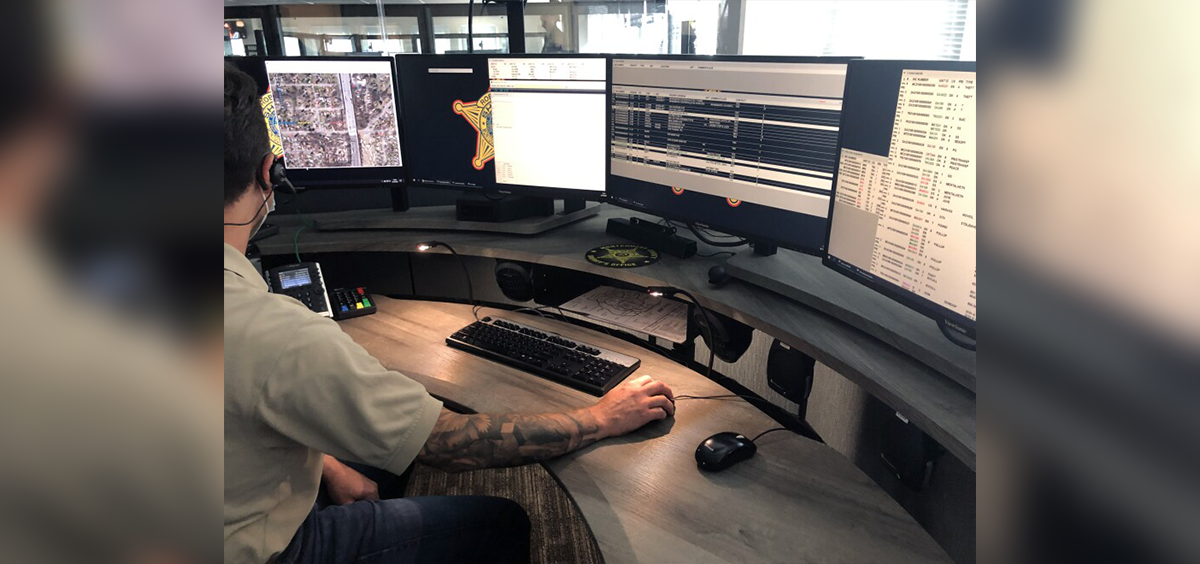A dispatcher at the Montgomery Regional Dispatch Center answers 911 calls and enters information into a Computer-Aided Dispatch System.