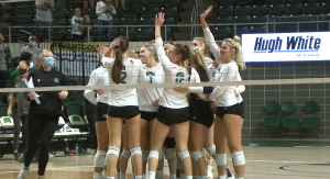 Members of the Ohio volleyball team celebrate following the match point over Kent State on Oct. 20, 2021. The Bobcats defeated the Golden Flashes in five sets.