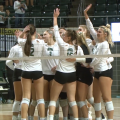 Members of the Ohio volleyball team celebrate on the court following the match point over Kent State on Oct. 20, 2021.
