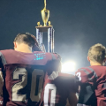 Vinton County players hoist a trophy