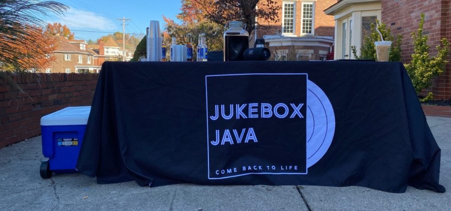 Jukebox Java standing in front of a fraternity house on College Street [Nick Viland| WOUB]