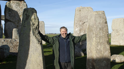 Professor Mike Parker Pearson between two Stonehenge bluestones.