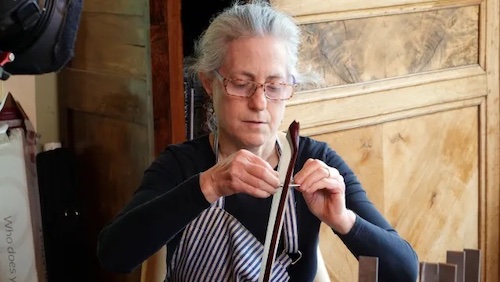 woman making a fiddle bow