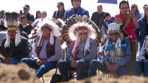 Old Native American men officiating at reburials
