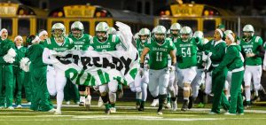 The Fairland Dragons enter the field for the Ohio High School Athletic Association football playoffs’ region 23 semifinal game against the West Jefferson Rough Ridersat Obadiah Harris Athletic Complex in Chillicothe, Ohio, Saturday, Nov. 13, 2021.