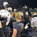 Bloom-Carroll players huddle up, hold up the regional title trophy, and celebrate the win