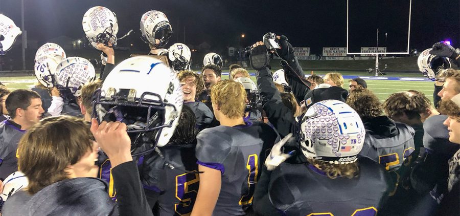 Bloom-Carroll players huddle up, hold up the regional title trophy, and celebrate the win