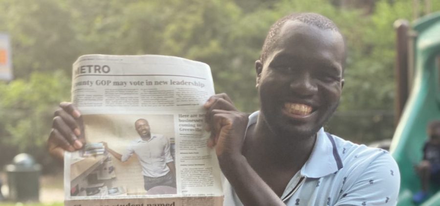 Moses Namara with news article