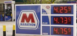 Gasoline prices are seen on Nov. 17 in Miami Beach, Fla.