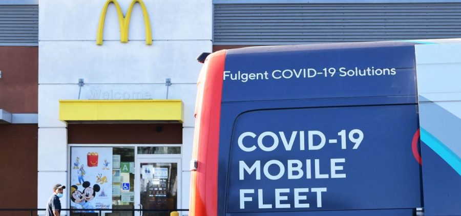 A man approaches a van from a COVID-19 vaccine mobile clinic hosted by McDonald's and the California Department of the Public Health in September in Los Angeles.