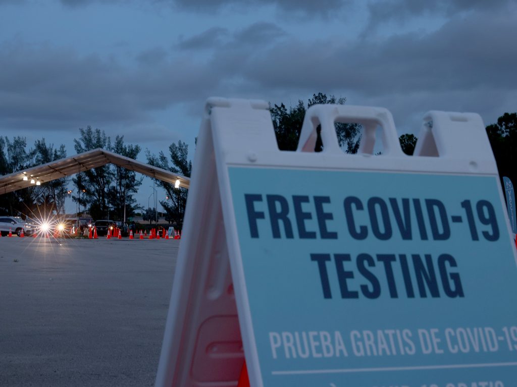 COVID-19 tests are administered at a 24-hour drive-through site set up by Miami-Dade County, Fla., and Nomi Health in August. Some workers will have the option of getting weekly COVID-19 tests instead of being vaccinated.