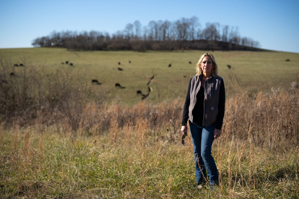 Dana Schutte stands for a portrait in front of farmland that a proposed solar farm would be built on in Jackson, Ohio, on Friday, Dec. 3, 2021. “You move out here to retire and then this comes up,” said Schutte while speaking her concern that the solar farm is going to alter her property’s value.