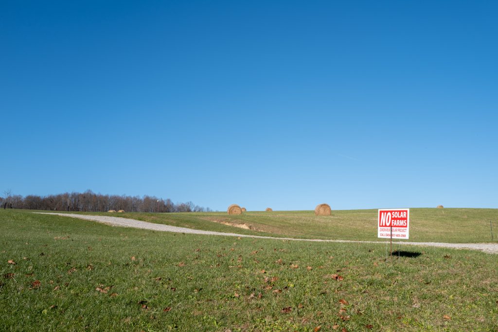 A sign to raise awareness about a proposed solar farm in Jackson County, Ohio, is seen in a community member’s lawn along the road to Schutte’s home, on Friday, Dec. 3, 2021.
