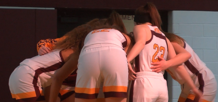 Meigs players huddle around one another before the game