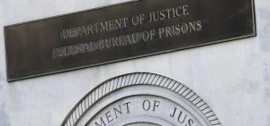 A sign for the Department of Justice Federal Bureau of Prisons is displayed at the Metropolitan Detention Center in the Brooklyn borough of New York.
