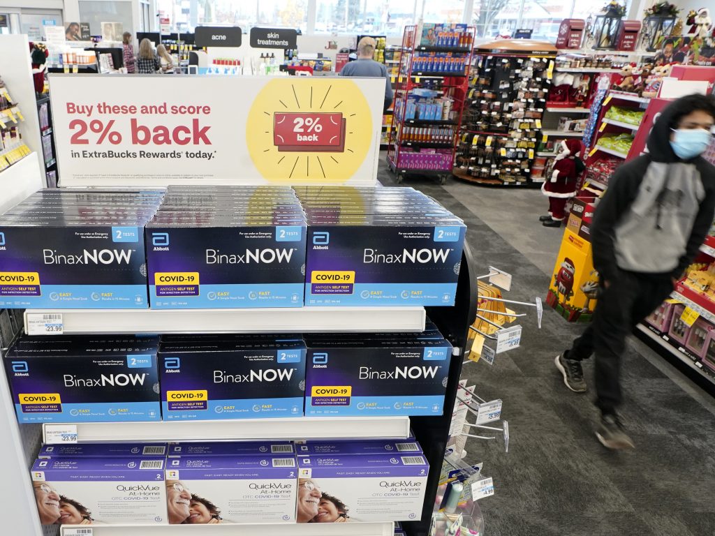 At-home coronavirus tests made by Abbott and Quidel are on sale Nov. 15 at a CVS store in Lakewood, Wash.