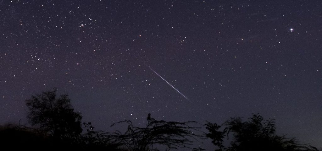 This photo taken late Dec. 14, 2018 with a long time exposure shows a meteor streaking through the night sky over Myanmar during the Geminid meteor shower seen from Wundwin township near Mandalay city.