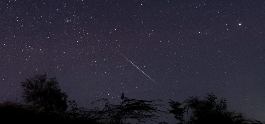 This photo taken late Dec. 14, 2018 with a long time exposure shows a meteor streaking through the night sky over Myanmar during the Geminid meteor shower seen from Wundwin township near Mandalay city.