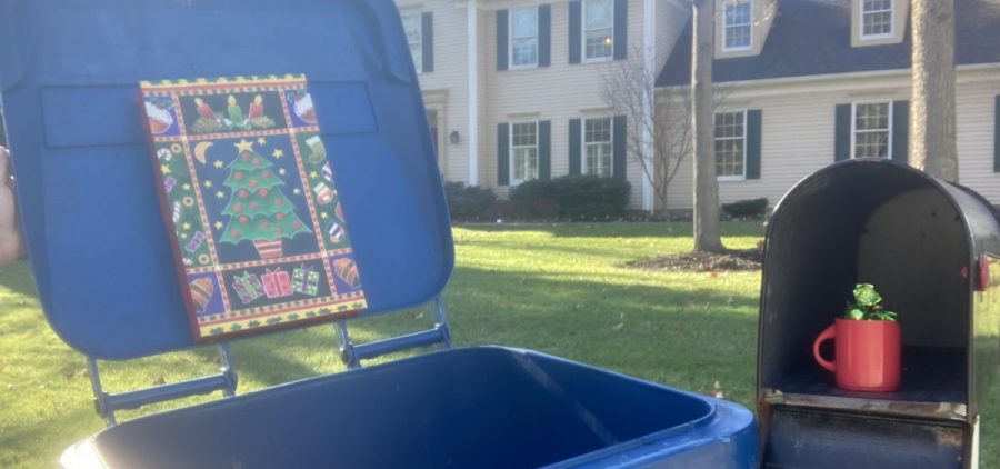 Gifts on a trash can lid and an open mailbox