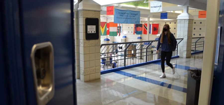 A masked student walks the hallway at Worthington Kilbourne High School in March 2021, as students came back to in-person learning with a mask mandate in place.