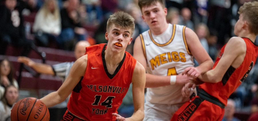 Keagan Swope, 14, of the Nelsonville-York Buckeyes drives towards the hoop during the Buckeyes game against the Meigs Marauders, in Pomeroy, Ohio, on Friday, Jan. 28, 2022. The Marauders went on to win 70-66.