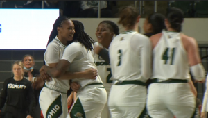 Ohio guard Cece Hooks gets a hug from teammate Erica Johnson following her basket that made her the all-time leading scorer in Mid-American Conference history.