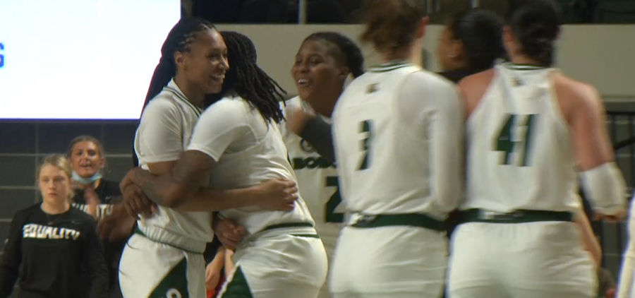 Ohio guard Cece Hooks gets a hug from teammate Erica Johnson following her basket that made her the all-time leading scorer in Mid-American Conference history.