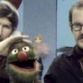Jim Henson and puppeteer with a muppet