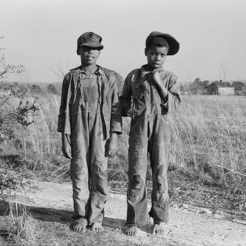 Two boys at Gees Bend, Alabama, 1937 wearing jeans