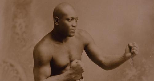 Boxer Jack Johnson striking bare knuckle pose
