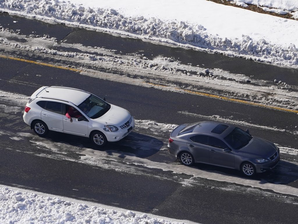 Stranded motorists wait for a tow on Interstate 95 on Tuesday in Ladysmith, Va. About 48 miles of the interstate were closed due to ice and snow.