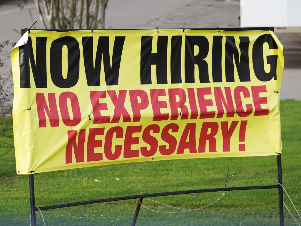 A help wanted banner reads Now Hiring. No Experience Necessary