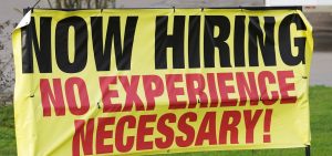 A help wanted banner reads Now Hiring. No Experience Necessary