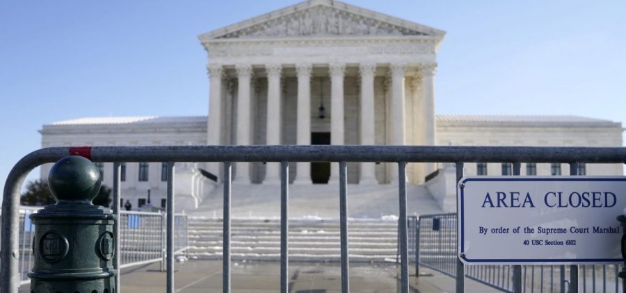 The Supreme Court building behind some barriers