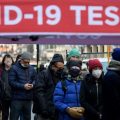 People wait in line to receive a COVID-19 test on Tuesday in New York.