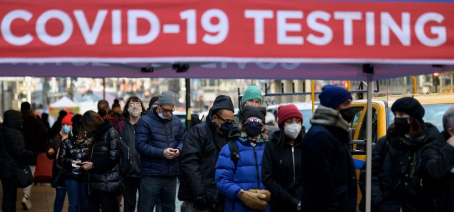 People wait in line to receive a COVID-19 test on Tuesday in New York.