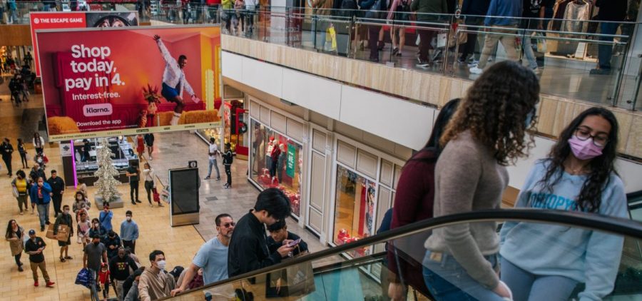 People shop in The Galleria mall in Houston
