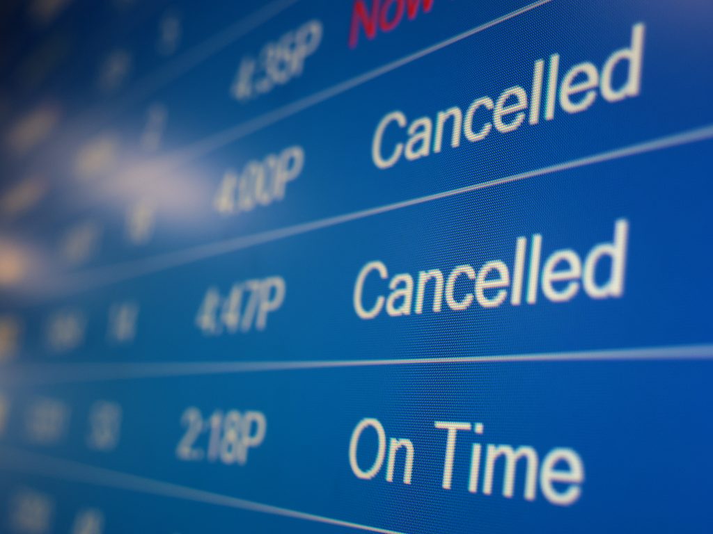 A flight information display system shows cancelled flights