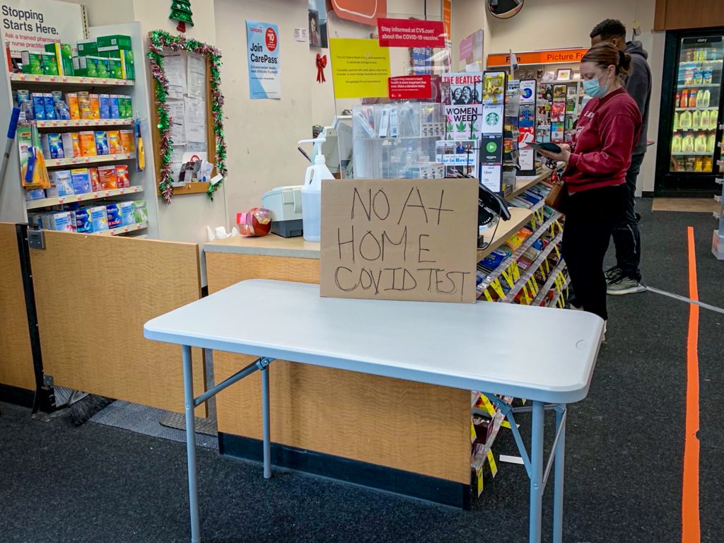 A sign at a pharmacy in D.C. reads "No At Home COVID Test"
