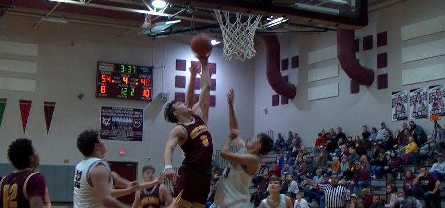 Meigs and Vinton Country players go up for a free rebound ball
