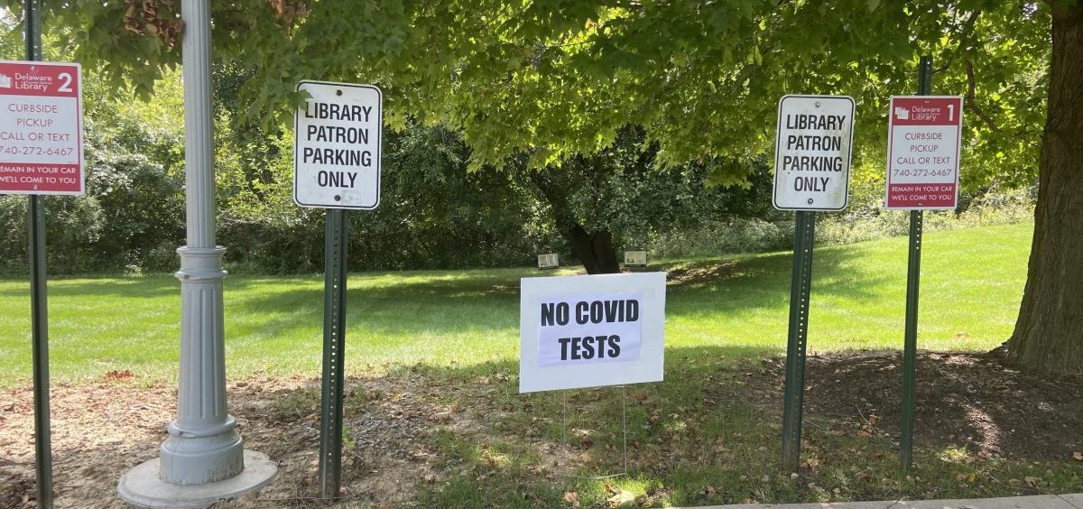 "No COVID TESTS" sign in parking lot of Powell Library